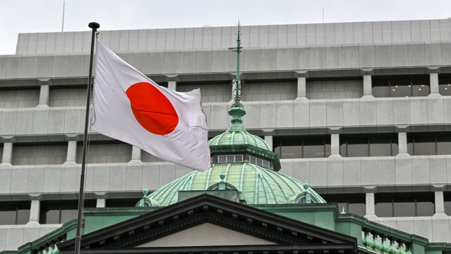 Bank of Japan keeps benchmark interest rate steady as it treads cautiously